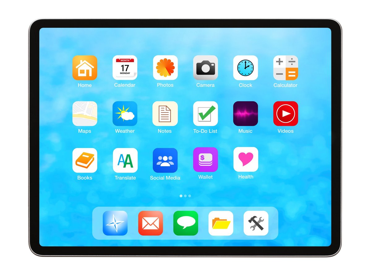 Tablet computer showing home screen with various app icons and business software